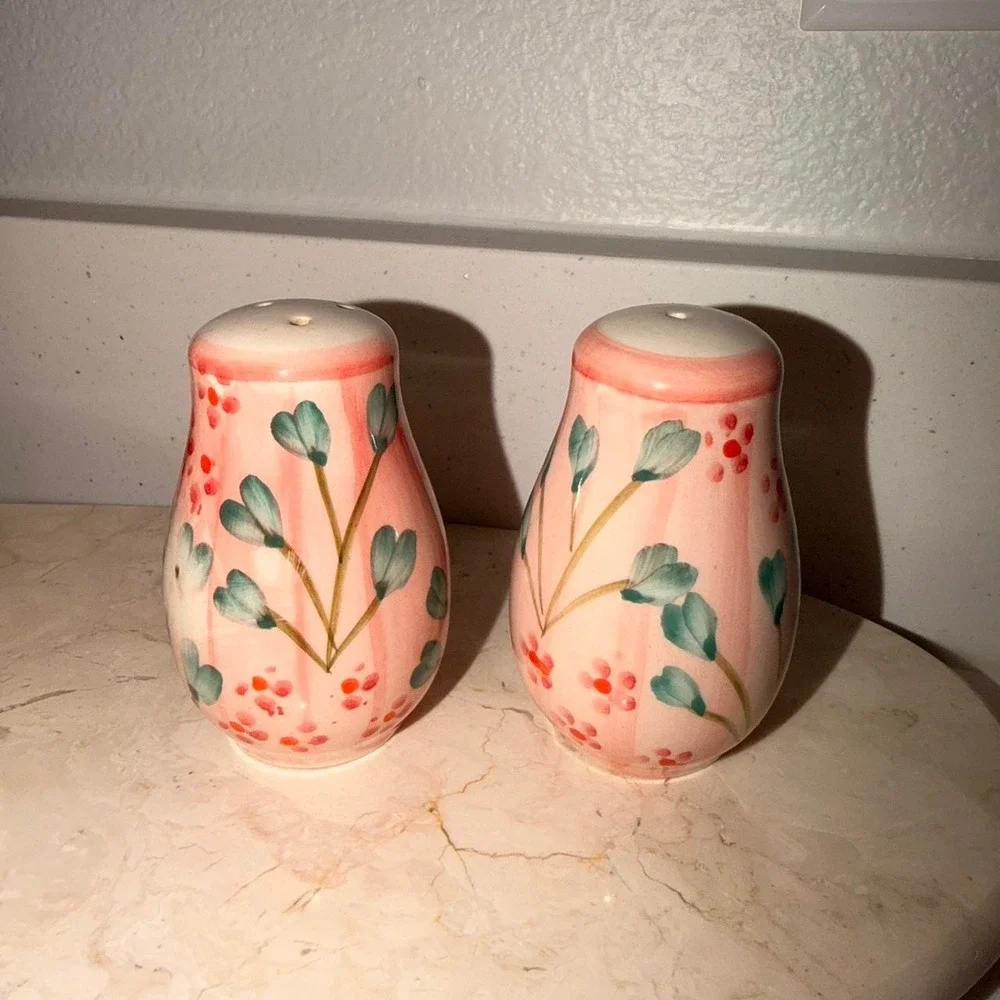 Handmade ceramic salt and pepper shakers w/ pink background & green/red floral